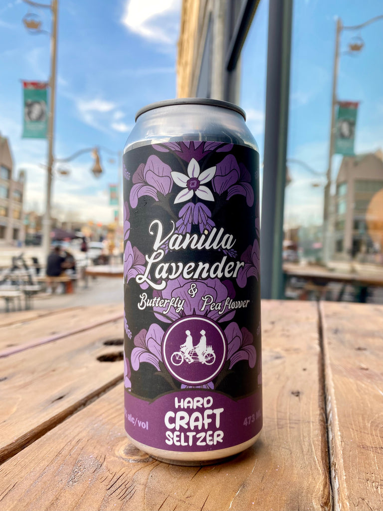 Vanilla Lavender Butterfly pea flower seltzer can on a patio table