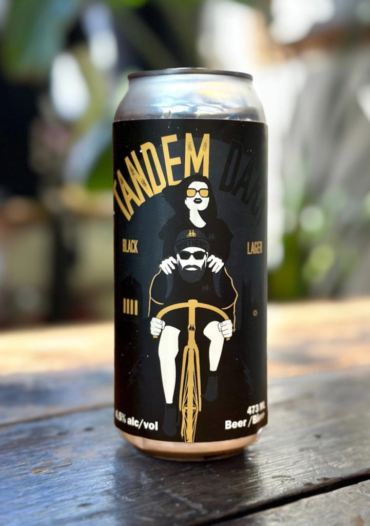 Tandem Dark Black Lager Can on table